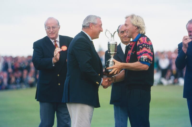 Greg Norman receives the Claret Jug following his victory at Royal St George's in 1993. Photograph: Getty Images