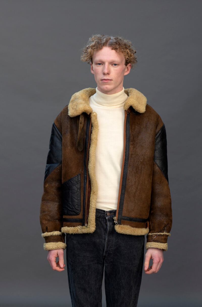 Cream polo, shearling jacket and denims from The Harlequin 