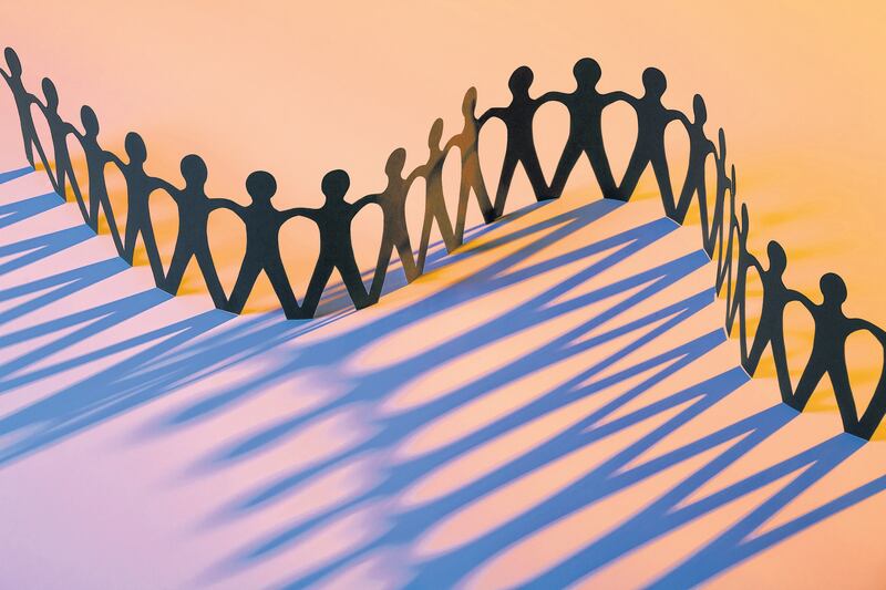 Paper Men Joining Together As Team, Union, Family or Network
