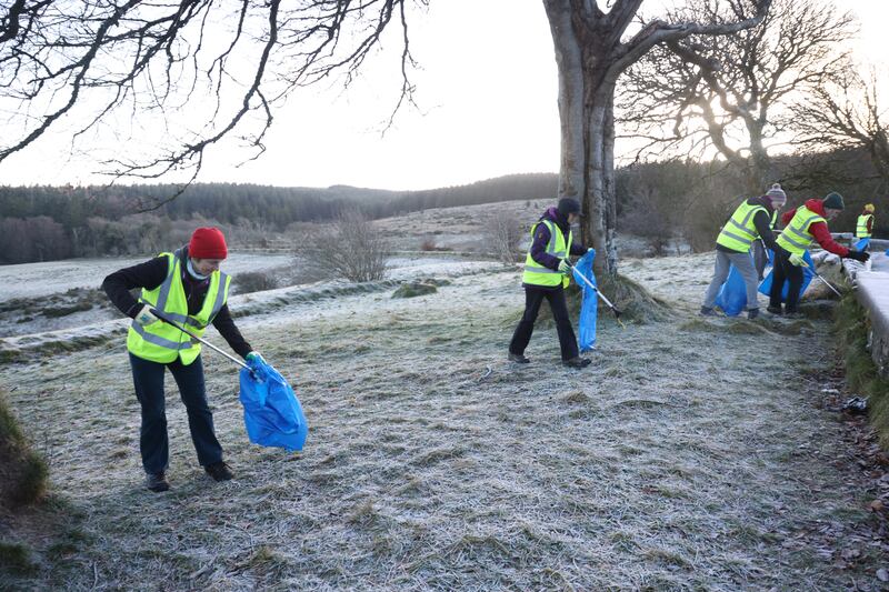  Ruth Murphy (left) and other members of the Irish Ramblers Club Pure Mile Group at work picking up discarded litter and rubbish.  Photo: Bryan O’Brien / The Irish Times 
