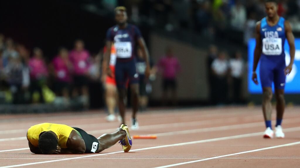 Usain Bolt of Jamaica falls to the track in the Men’s 4x100 Relay final. Photo: Michael Steele/Getty Images