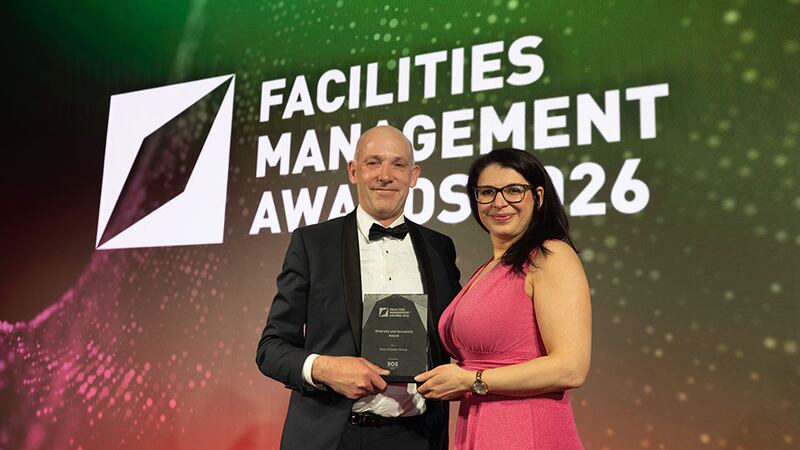 Ronan McDonnell, operations director, SOS Group, presents the diversity and inclusivity award to Narcisa Popovici, Aura Holohan Group