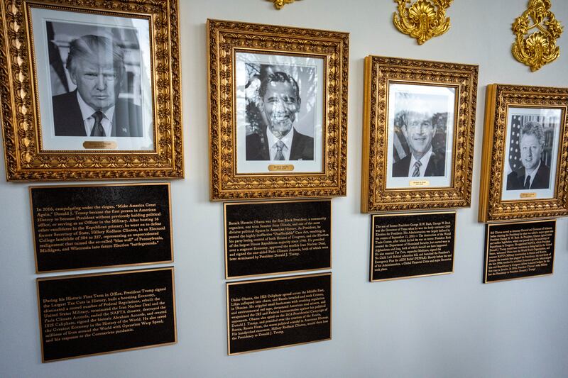 New text descriptions under images of president Donald Trump and former presidents Barack Obama, George W Bush and Bill Clinton on the "Presidential Walk of Fame" at the White House in Washington. Photograph: Doug Mills/The New York Times