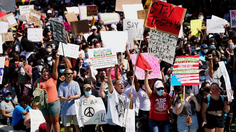 People rally to protest the death of George Floyd in Houston on Tuesday, June 2nd, 2020. Floyd died after a Minneapolis police officer pressed his knee into Mr Floyd’s neck for several minutes even after he stopped moving and pleading for air. Photograph: David J Phillip/AP Photo