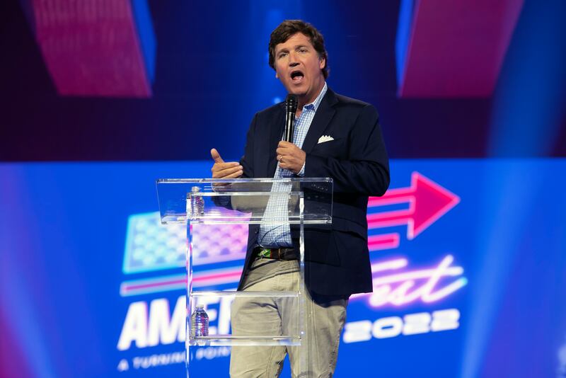 Tucker Carlson speaks in Phoenix on December 17th, 2022. Photograph: Rebecca Noble/The New York Times                  