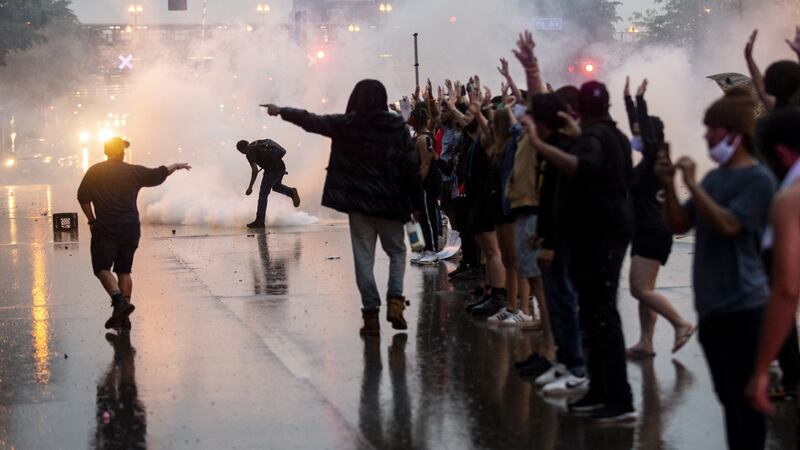 Tear gas is fired as protesters clash with police during Tuesday night’s  demonstrations  in Minneapolis, Minnesota. Photograph: Stephen Maturen/Getty Images