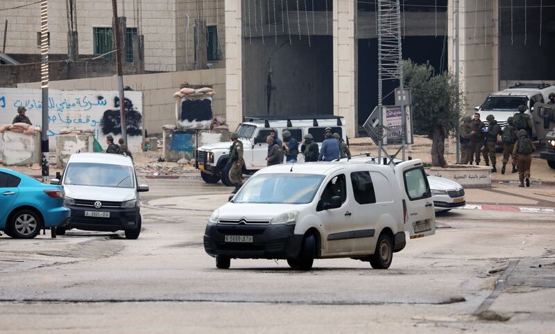 Israeli security personnel monitor the area following a shooting attack in the West Bank town of Hawara, near the city of Nablus, on Sunday. Photograph: Alaa Badarneh/EPA