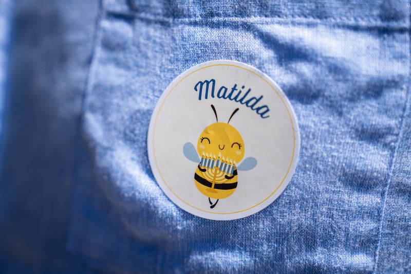 A person wears a "Matilda" sticker as they arrive at the funeral service of Matilda, the youngest victim of the Bondi Beach mass shooting. Photograph: Audrey Richardson/Getty Images