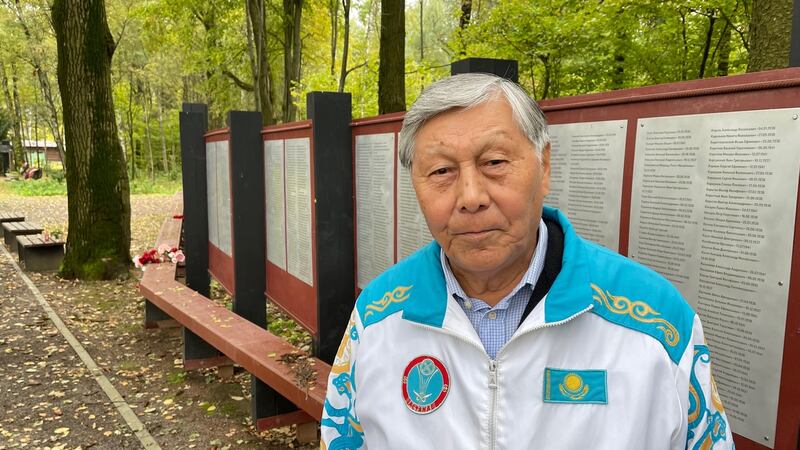 Sapar Iskakov, from Kazakhstan, standing by lists of the names of more than 6,600 people who were executed and buried at Kommunarka in southern Moscow from 1937-41 by the Soviet security services. Photograph: Daniel McLaughlin