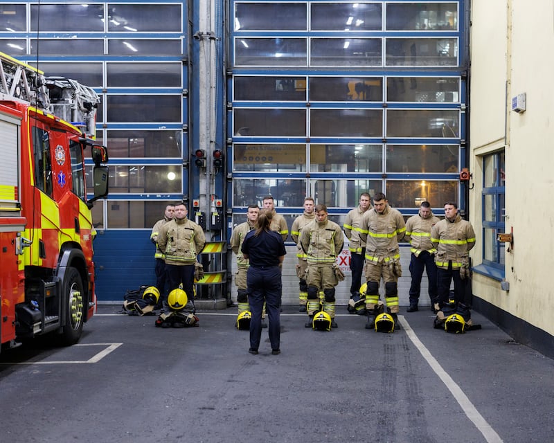 Members of the Tara Street Fire Station prepare to go out for the night. Photograph: Dan Dennison