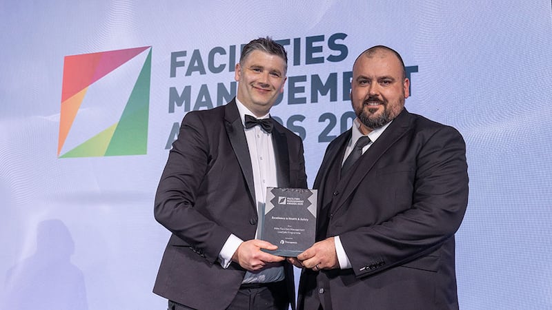 Marc Nixon, head of marketing at Transpoco, presents the excellence in health & safety award to Patrick Mahon, Mitie Facilities Management