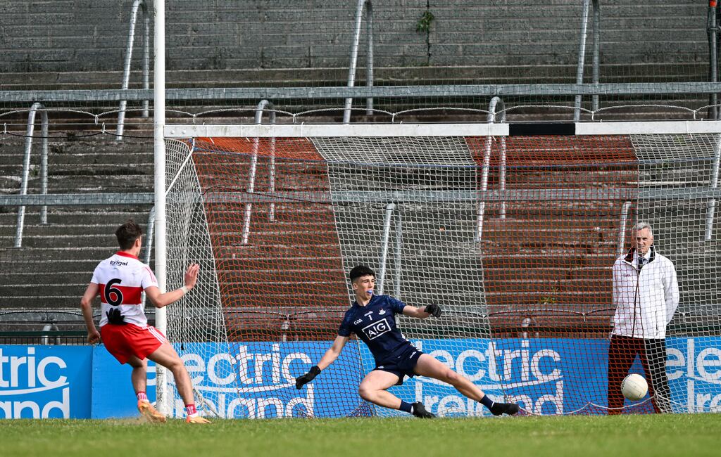 Derry's James Sargent scores a goal from a penalty past Dublin goalkeeper Cillian Murray during the Electric Ireland All-Ireland Minor Football Championship semi-final at the Athletic Ground. Photograph: Cathal McOscar/Inpho