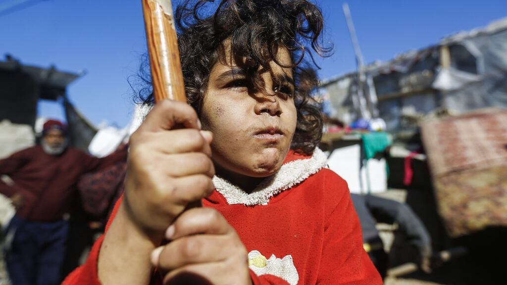A Palestinian girl stands outside her home in the Jabalia refugee camp in the northern Gaza Strip. MOHAMMED ABED/AFP/Getty Images