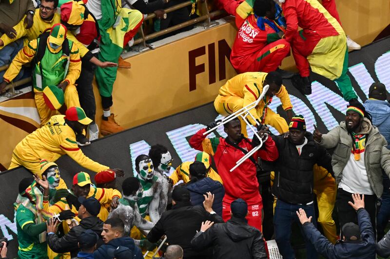 Trouble spills on to the pitch from the stands during the Africa Cup of Nations between Senegal and Morocco in Rabat. Photograph: Paul EllisAFP via Getty Images