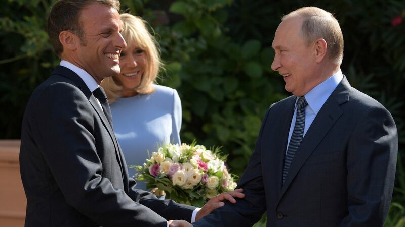 French president Emmanuel Macron and French first lady Brigitte Macron meet Russian president Vladimir Putin  at Fort Bregancon near the village of Bormes-les-Mimosas. Photograph: Sputnik/Sergei Guneevn/Kremlin