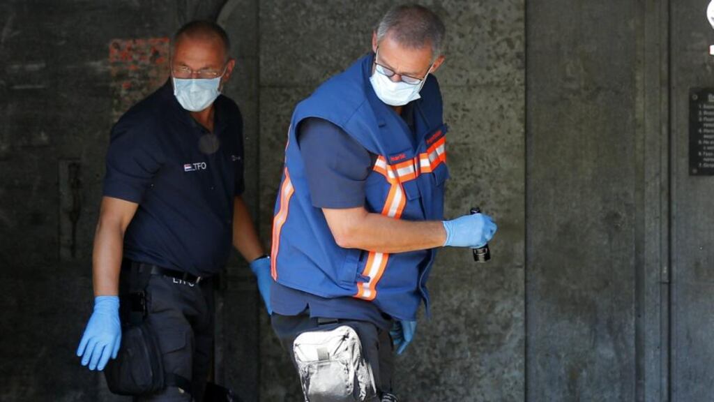 Forensic experts from the Netherlands check bodybags holding the remains of victims of the Malaysia Airlines crash in Ukraine, before their transfer by train froim Torez to Kharkiv. The bodies of Dutch victims are to arrive in Eindhoven by military transport aircraft on Wednesday. Photograpgh: Robert Ghement/ EPA