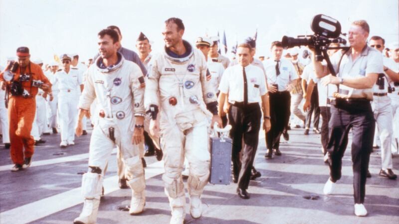 Astronauts John Young (left) and Michael Collins walk on the deck of the recovery ship USS Guadalcanal after returning to earth following the Gemini 10 space mission. Photograph: NASA/Getty