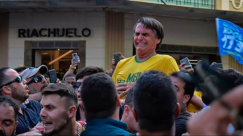 Knife attack: Jair Bolsonaro grimaces after being stabbed in the stomach on Thursday. Photograph: Raysa Leite/AFP