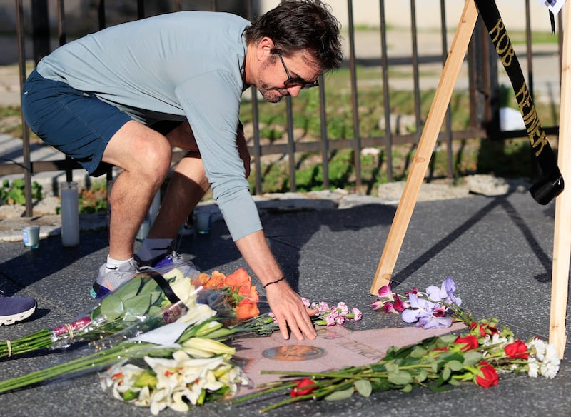 A person places their hand on director Rob Reiner's star on the Hollywood Walk of Fame. Photograph: Mario Tama/Getty Images