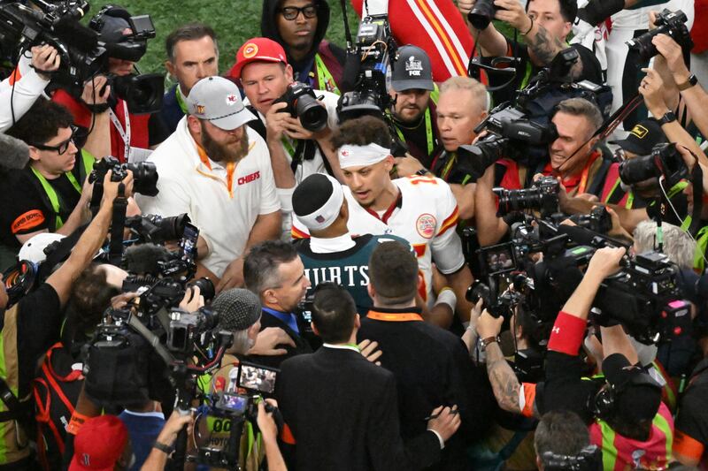 Kansas City Chiefs quarterback Patrick Mahomes talks to Philadelphia Eagles quarterback Jalen Hurts after his side's loss in Super Bowl LIX. Photograph: Emily Kask/The New York Times