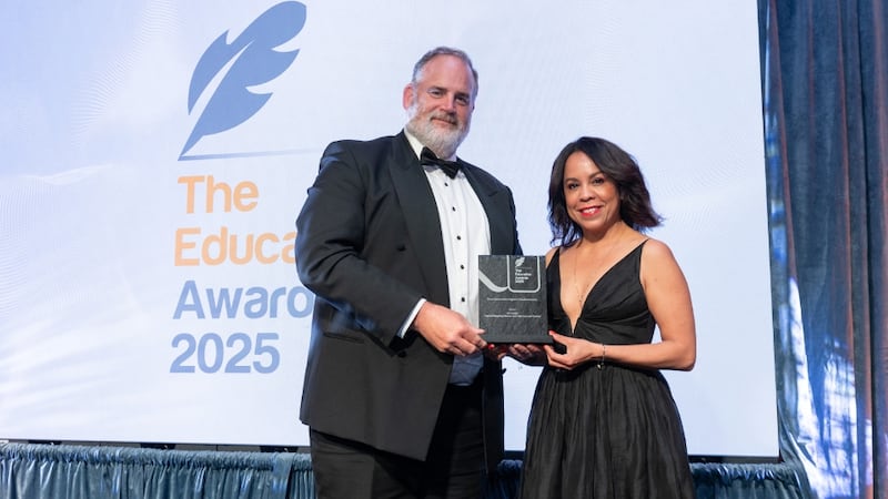 Graham Heaslip, awards judge, presents the most innovative digital transformation to Heydi Foster, An Cosán
