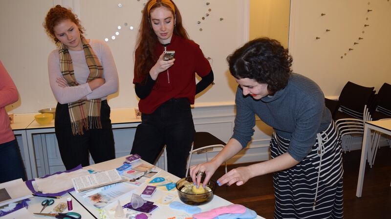 Charlotte Amrouche demonstrating alternative menstrual products at a Míosta workshop in UCD.
