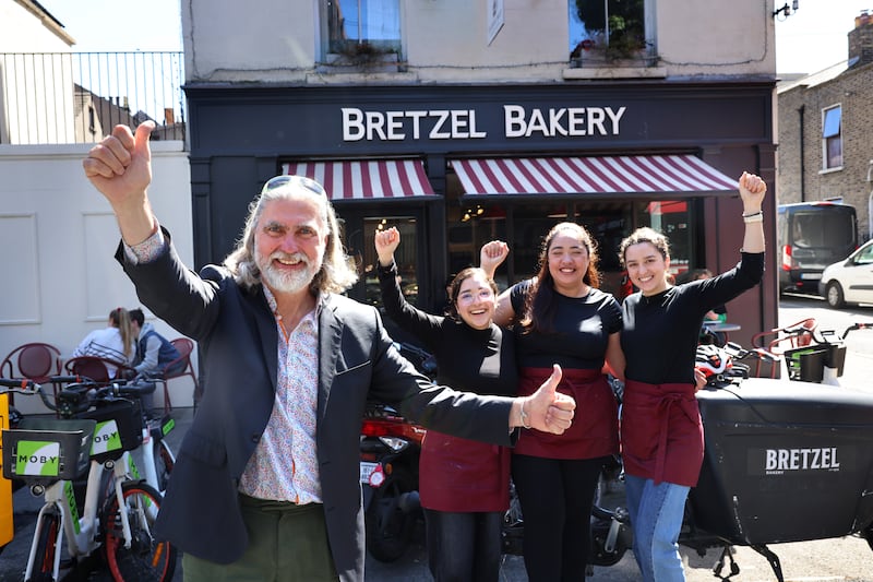 William Despard, owner of Bretzel Bakery, in Portobello, Dublin, and father of University Challenge winner Oscar, celebrating with staff members Carolina Deustua, Larissa Brito and Eduarda Moleina. Photograph: Dara Mac Dónaill 
