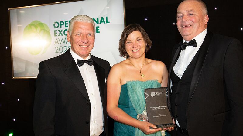 Eric Doyle, Managing Director at ISS Facility Services Ireland, presents the Operational Excellence in Manufacturing award to Deirdre Travers & Michael Judge, Bausch & Lomb Waterford.