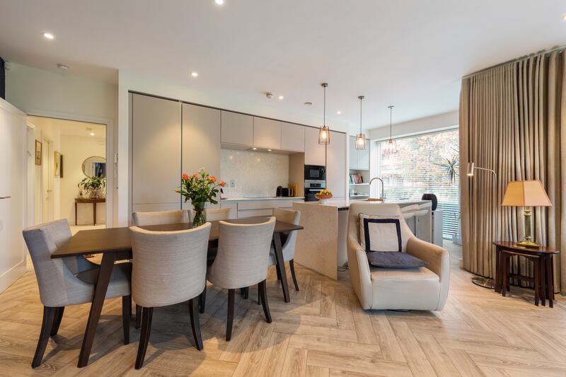 A breakfast bar neatly divides the kitchen from the living space