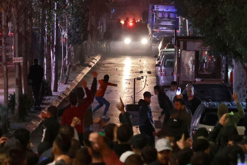 People clash with Palestinian security forces during a rally in solidarity with the Palestinians of the Gaza Strip in the West Bank city of Ramallah, on October 17th. Photograph: Jaafar Ashtiyeh/AFP via Getty