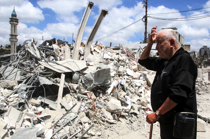 A man looks at the damage as displaced residents return to Nabatieh in southern Lebanon on June 15th. Photo by Mahmoud Zayyat/AFP via Getty Images