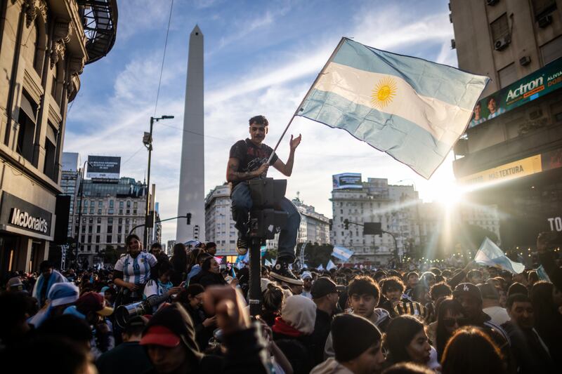 Fans celebrate Argentina's victory in Buenos Aires. Photograph: Tomas Cuesta/Getty Images