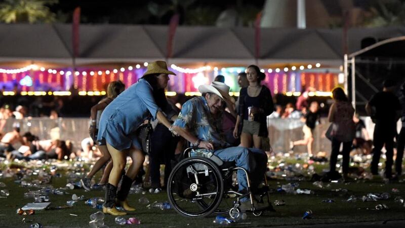 Mandalay massacre: a wheelchair user is taken away from the Route 91 Harvest festival. Photograph: David Becker/Getty