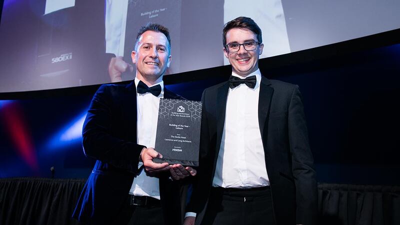 Stephen Pierce, Area Sales Manager, Vescom presents the Building of the Year - Leisure award to Matthew Murphy, Lawrence and Long Architects.