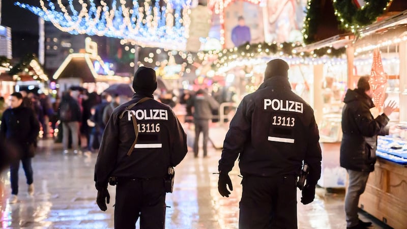 Police patrol at the reopened Christmas market  in Berlin after a deadly truck attack. Photograph: Clemens Bilan/AFP/Getty Images