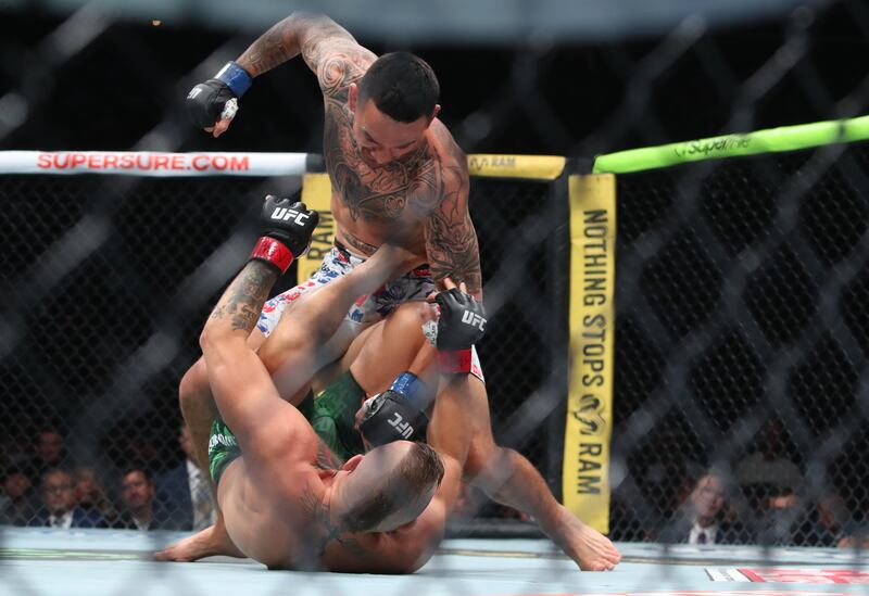 Max Holloway and Conor McGregor fight at UFC 329 in Las Vegas. Photograph: Tom Hogan/Inpho