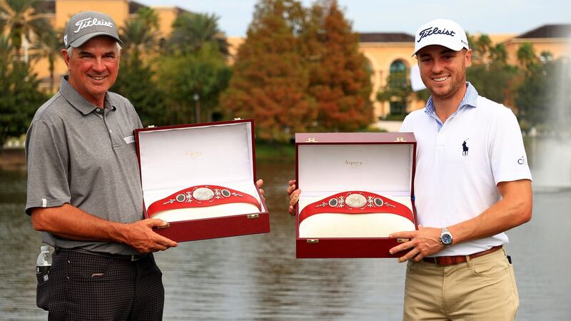 Mike and Justin Thomas celebrate after winning the PNC Championship at the Ritz Carlton Golf Club  in Orlando. Photograph: Mike Ehrmann/Getty Images