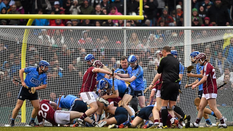 Players from both teams get involved in a scuffle during the AIG Fenway Hurling Classic between Dublin and Galway in Boston. Photograph: Ray McManus/Sportsfile