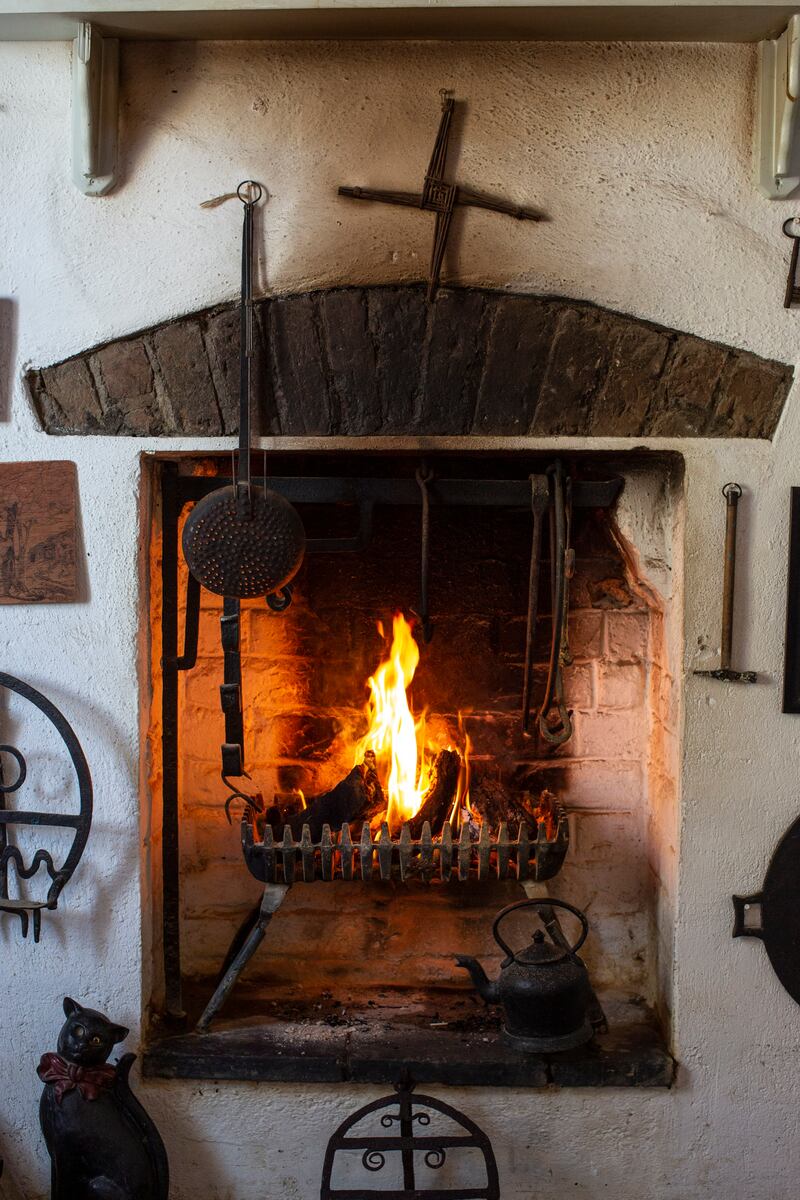 Rockbrook Cottage, Coliemore Road, Dalkey: 'Just one fireplace is in use at the moment, and there’s a turf fire burning when The Irish Times visits, giving off that unmistakable waft of the west.'