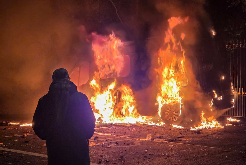 A Garda van set alight on Garter Lane near the former Citywest Hotel. Photograph: Colin Keegan/Collins Dublin