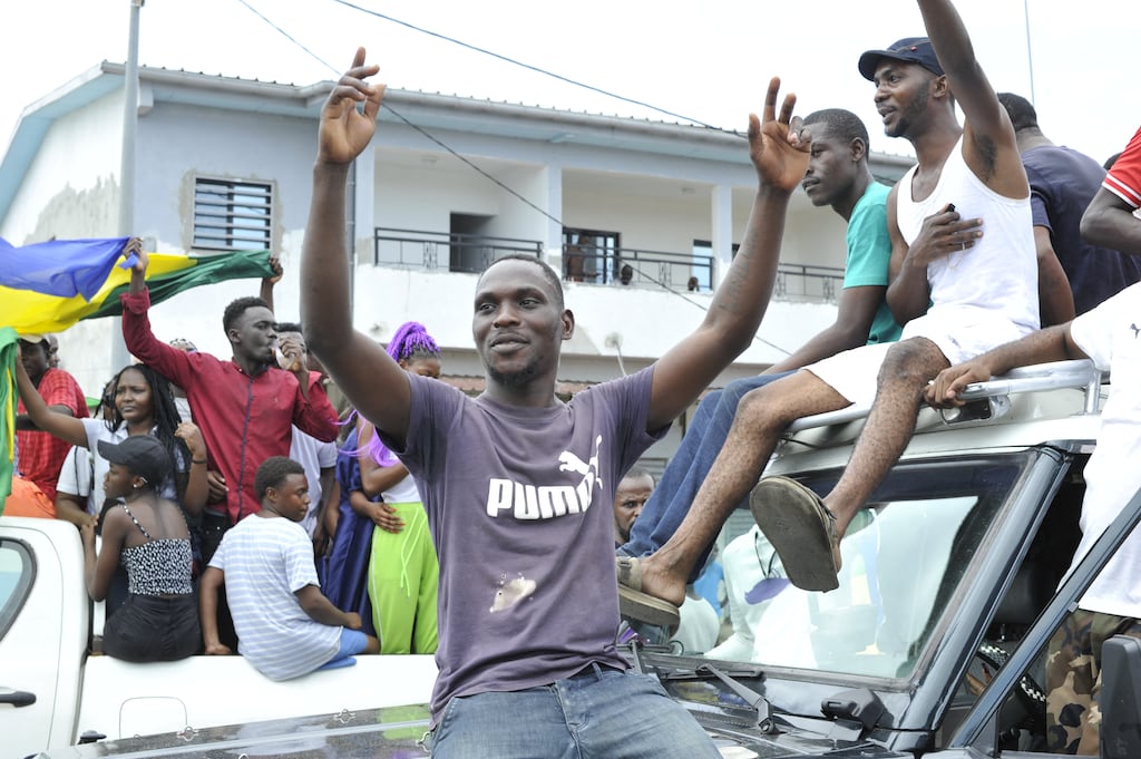 Gabon residents celebrate in Libreville on Wednesday after a group of Gabonese military officers announced they were 'putting an end to the current regime'. Photograph: AFP