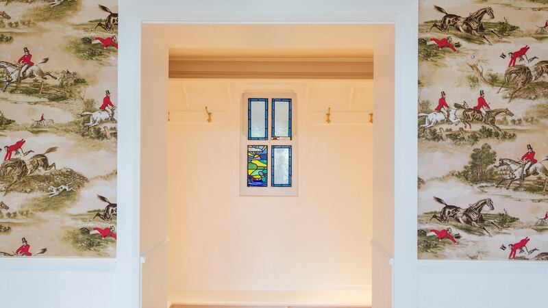 At the very back of the house, off the stableyard, is a boot room wallpapered with hunting images.