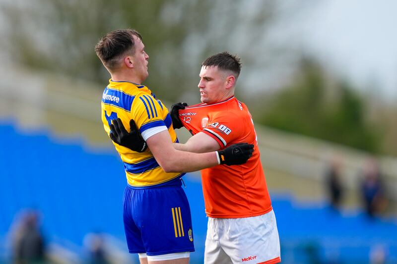 Enda Smith tussles with Greg McCabe as Roscommon lead Armagh in Division 1.
Photograph: James Lawlor/Inpho