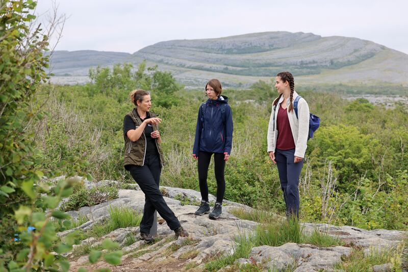 Phoebe Larkin, head guide at the Burren National Park, with Melanie Bucher and Michelle Suppiger, from Switzerland. Photograph: Dara Mac Dónaill