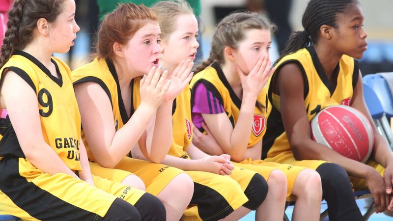Basketball team members from Gaelscoil Ultain in Monaghan watch their team lose in the  Games. Phototograph: Leon Farrell/Photocall Ireland.