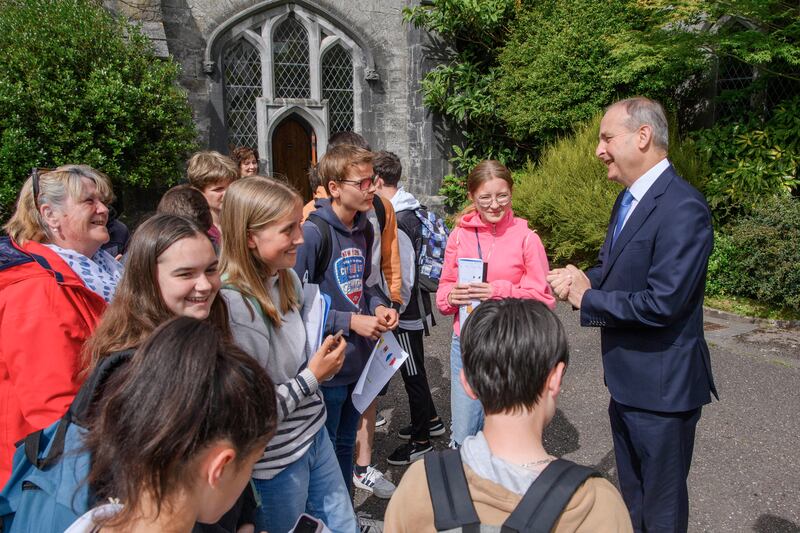 Taoiseach Micheál Martin meets a group of French schoolchildren during a visit to the Irish Civil War National Conference at UCC, Cork on Wednesday.
