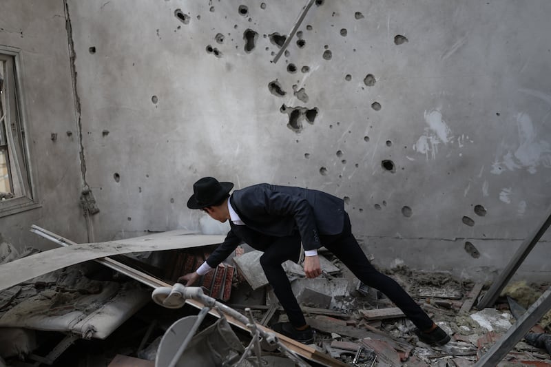 An ultra-Orthodox Jewish man assesses the damage inside a house following an Iranian strike over Bnei Brak in central Israel on March 31st. Photograph: Ilia Yefimovich/AFP via Getty