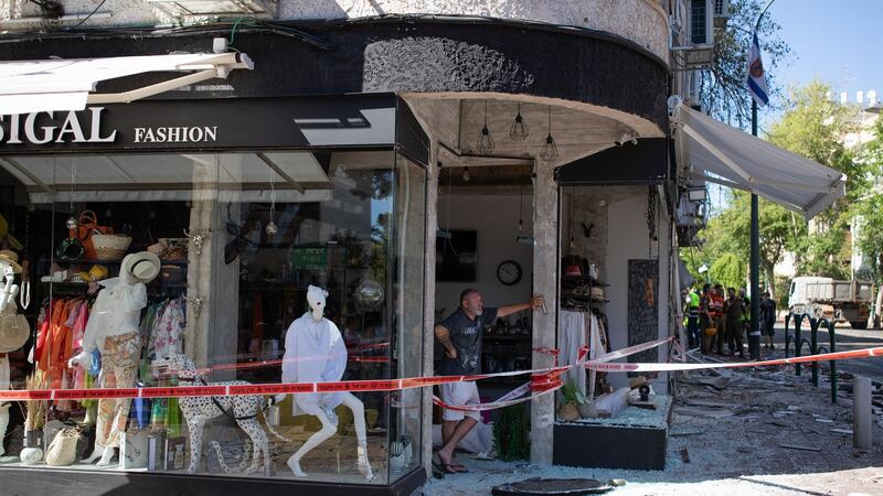 A man inside a shop damaged by a rocket fired from the Gaza Strip, in Ramat Gan, near Tel Aviv. Photograph: Corinna Kern/The New York Times