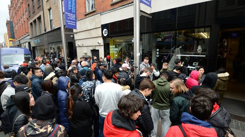 A large number of people queue for Kanye West’s  Yeezy Boost 350 runners outside JD Sports on Mary Street, Dublin. Photograph: Dara Mac Dónaill