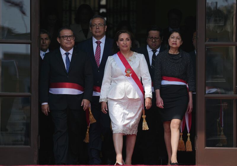 Dina Boluarte (centre) with her new cabinet. Photograph: AP